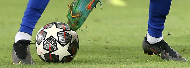 Soccer players battle for the ball in the UEFA Champions League