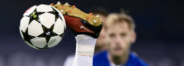 A soccer player kicks the official UEFA Champions league ball