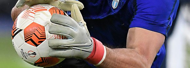 A soccer goalkeeper hold the official UEFA Europa League ball during a game