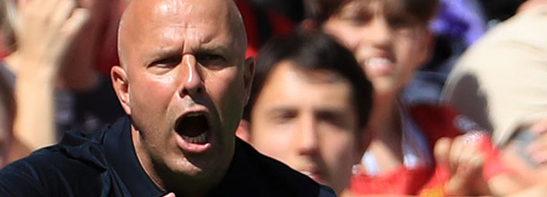 Liverpool soccer coach Slot shouts on the touchline during a game in the Premier League