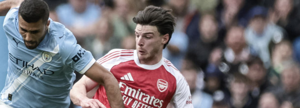 Arsenal and Manchester City soccer players in action in the English Premier League