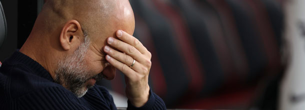 Manchester City coach Pep Guardiola looks sad after a loss in the Premier League