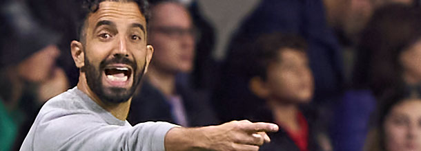 Manchester United coach Amorim gestures on the sideline during an EPL game