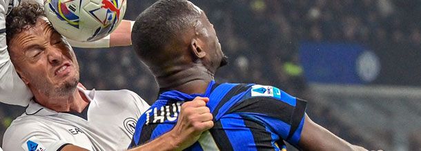 Inter Milan and Napoli soccer players battle for the ball in Serie A