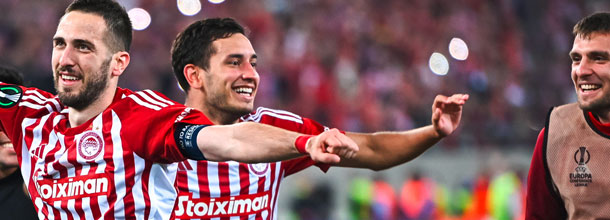 Olympiacos soccer players celebrate a victory in the UEFA Europa Conference League