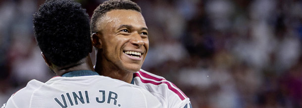 Real Madrid soccer stars Mbappe and Vini Jr. celebrate a goal in the UEFA Champions League