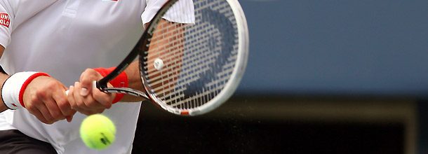 A player hits a shot during a match on the tennis ATP Tour